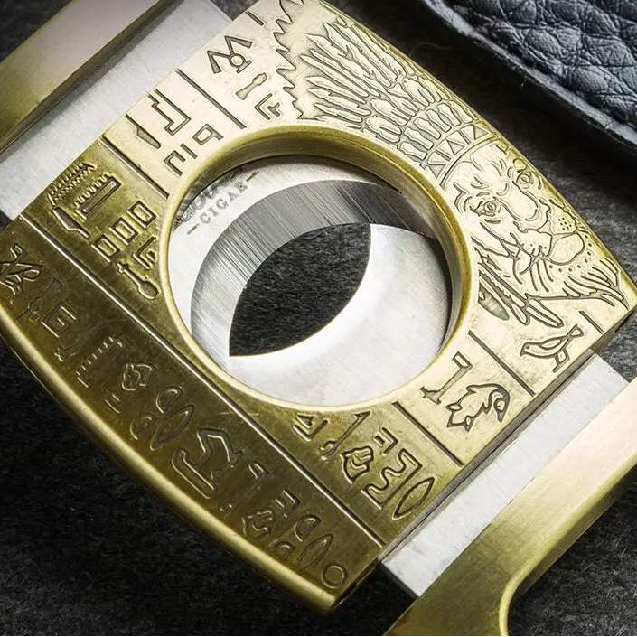 Lubinski cutter opened with dual blades extended on leather tray