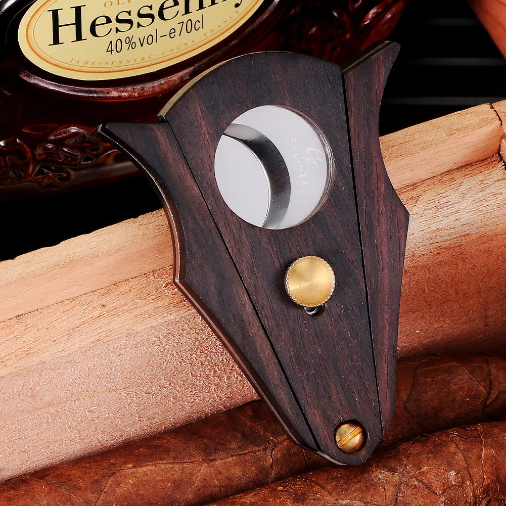 Cigar being cut with GALINER guillotine showing clean two-edged action