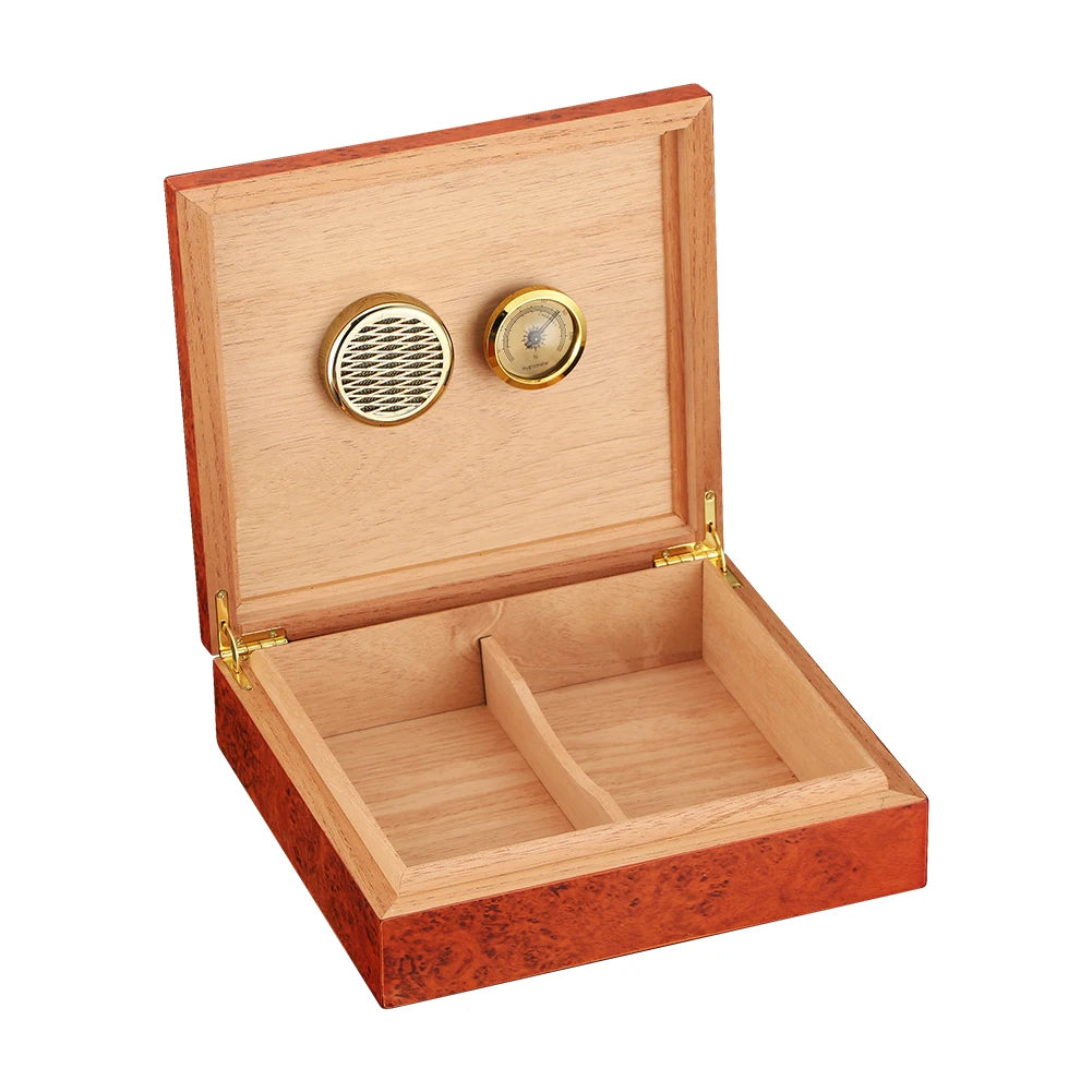 Cedar wood humidor with brass hardware next to glass of whisky