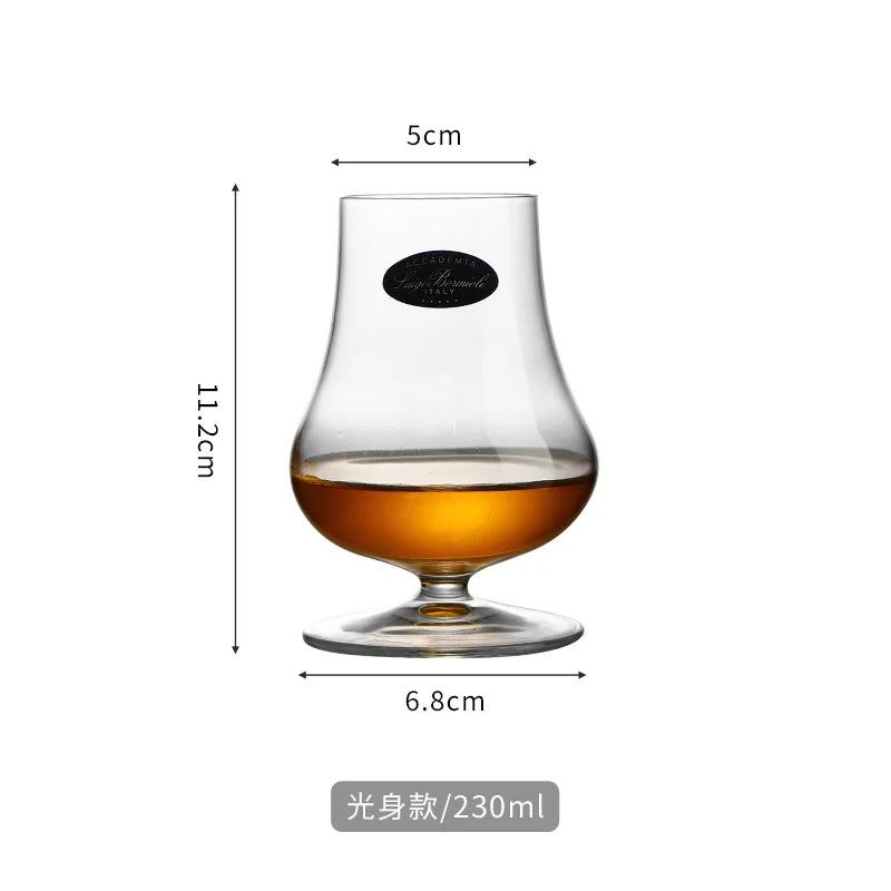 Whisky being poured into clear crystal snifter, highlighting transparency