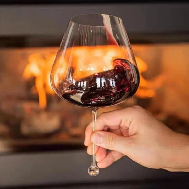 close up of thin rim crystal wine glass showing wide bowl for aromatics