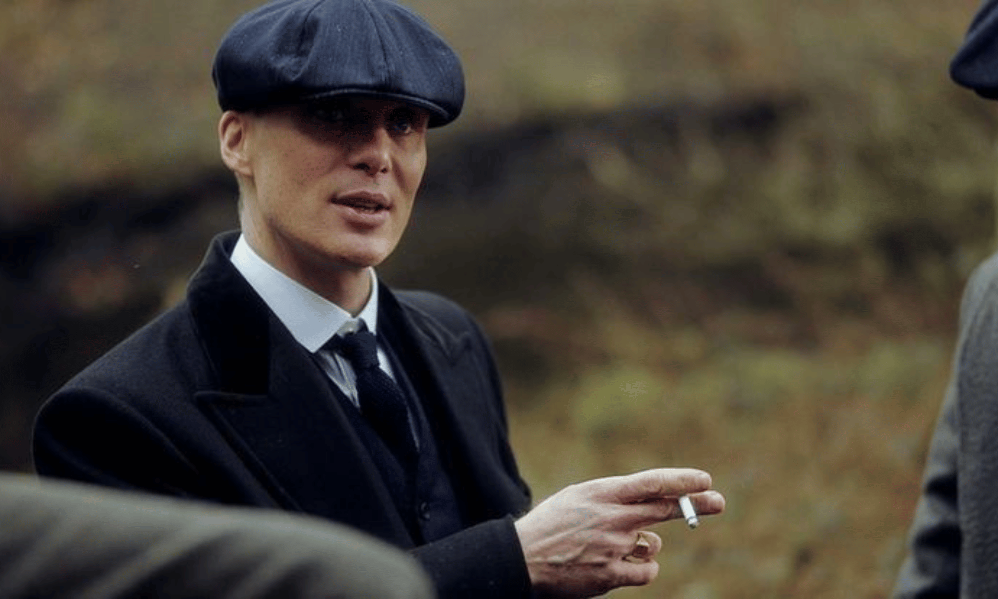 Outdoor portrait with fitted beret and clean tailoring calm, measured presence