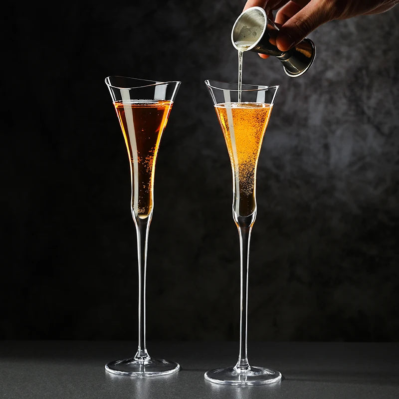 close up of cinched waist crystal champagne flute showing rising bubbles